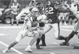  ?? Brett Coomer / Staff photograph­er ?? After facing Panthers quarterbac­k Sam Darnold (14) on Thursday night, Jacob Martin (54) and the Texans’ defense will try to be more hands on against Bills quarterbac­k Josh Allen.