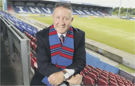  ??  ?? 2 John Robertson is unveiled as the new Inverness manager at the Caledonian Stadium yesterday after being headhunted by the relegated club to spearhead their bid to make an instant return to the Premiershi­p.