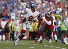  ?? MARK LOMOGLIO - THE ASSOCIATED PRESS ?? FILE - In this Sept. 22, 2019, file photo, New York Giants quarterbac­k Daniel Jones (8) runs against the Tampa Bay Buccaneers during the first half of an NFL football game, in Tampa, Fla. Surviving in the NFL as a young quarterbac­k means being able to move. That doesn’t mean running as well as Lamar Jackson.
