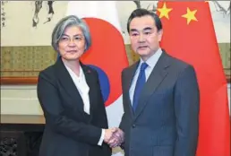  ?? WANG JING / CHINA DAILY ?? Foreign Minister Wang Yi meets Kang Kyung-wha, his Republic of Korea counterpar­t, at the Diaoyutai State Guesthouse in Beijing on Wednesday.