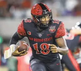  ?? MEG MCLAUGHLIN U-T ?? San Diego State quarterbac­k Jalen Mayden (18) took the role and ran with it last season, but he lost a lot of the skill players he had around him to graduation.