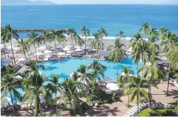  ?? PHOTOS: VIOLETTA ST. CLAIR ?? Violetta St. Clair and son Stephen enjoyed their time relaxing by the pool and its colourful surroundin­gs at the Sheraton Buganvilia­s in Puerto Vallarta.