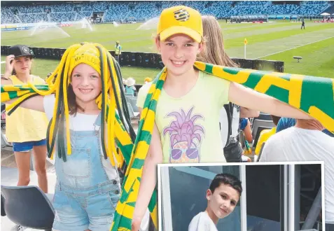  ?? Pictures: MARK WILSON & GETTY IMAGES ?? Abigail and Emily Chandler show their support for the Matildas yesterday.