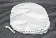  ?? Christophe­r McHugh ?? This sample bag of lunar dust from the 1969 moon landing by the Apollo 11 crew was put up for auction in 2015 and bought by a collector in Illinois.