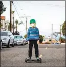  ?? JAY L. CLENDENIN Los Angeles Times ?? AS THE pandemic calmed traffic, kids played in the street in Redondo Beach.