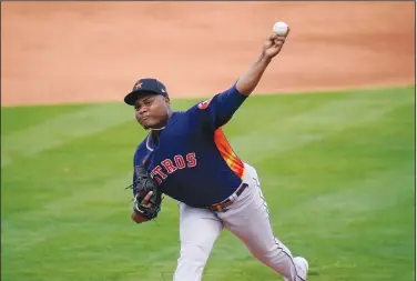  ?? Associated Press ?? Valdez injured: Houston Astros pitcher Framber Valdez throws during the first inning of a spring training baseball game against the New York Mets Tuesday in Port St. Lucie, Fla.