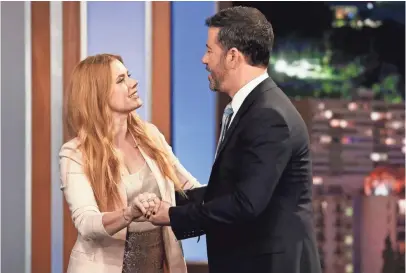  ?? PHOTOS BY RANDY HOLMES, ABC ?? Amy Adams, a potential Oscar nominee for her sci-fi drama Arrival, visits Jimmy Kimmel on his late-night
Live gig.