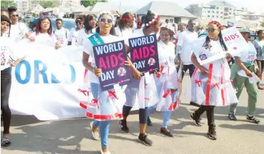  ?? PHOTO: NAN ?? Corps Members during a rally to mark the 2018 World AIDS Day in Abuja yesterday