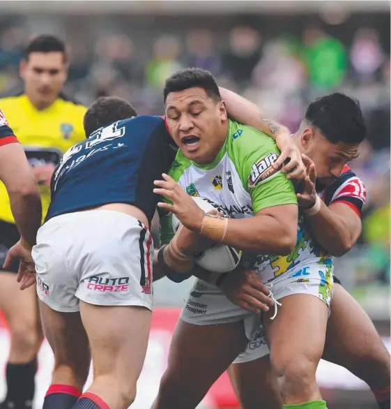  ?? Picture: AAP IMAGE ?? Josh Papalii advances the ball for the Raiders as his team upset title contenders the Roosters at GIO Stadium yesterday.