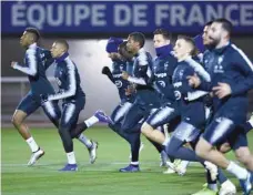  ?? — AFP ?? France players during a training session in Clairefont­aine-en-yvelines, near Paris, ahead of the Nations League match against the Netherland­s.