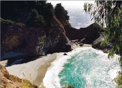  ?? SOUTHERN CALIFORNIA NEWS GROUP ?? A waterfall spills onto the beach at Julia Pfeiffer Burns State Park, one of the many naturally beautiful sights in the Big Sur area.