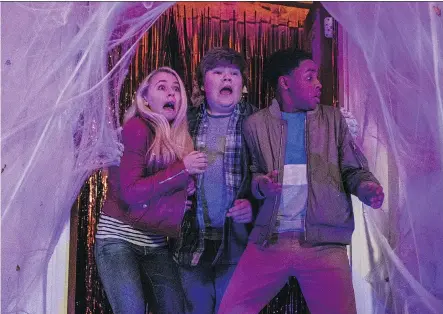  ?? COLUMBIA PICTURES ?? Madison Iseman, left, Jeremy Ray Taylor and Caleel Harris must conquer an evil plan to bring Halloween decoration­s to life.