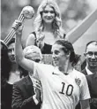  ?? ELAINE THOMPSON/AP ?? American Carli Lloyd took home the Golden Ball as MVP at the last World Cup, but this is a new years and team.