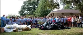  ??  ?? More than 100 volunteers take part in the Rivers Alive 2017 cleanup in the Cedartown area on Saturday.