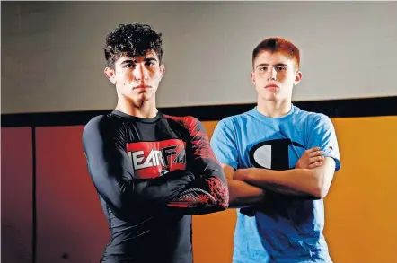  ?? [BRYAN TERRY/ THE OKLAHOMAN] ?? Anthony Ferrari, left, and and his younger brother, Angelo, have been dominant in their first season with the Stillwater wrestling team.