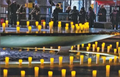  ?? (AP/Craig Ruttle) ?? Revson Fountain is lit Sunday during a ceremony at Lincoln Center in New York to remember those who died of covid-19 during the past year.