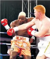  ??  ?? Joshua ‘Red Beast’ Pretorius lands a solid right cross during his bout against Justice Siliga