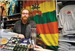  ?? PHOTO PIERRE-PAUL BIRON ?? Yoann Bergeron, gérant de la boutique Loulou, dans le Vieux-québec, est photograph­ié avec des articles ornés de feuilles de cannabis dont la vente sera interdite à compter d’aujourd’hui.