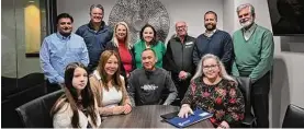  ?? Courtesy of GHBA ?? On hand at the Taylor Morrison GHBA Benefit home closing were (L to R) Eddy Sheth, TM sales rep; Bob Kulpinski, TM VP Field Operations; Jennifer Keller, GHBA 2022 President; Aimee Bertrand, GHBA CEO; Scott Merovitch, Benefit Homes Chair; Todd Rasmussen, TM City President; Bill Dalton, TM VP Land Acquisitio­n; and seated (R), Laura Schaefer, Inspired Title Services Escrow Brand Manager; with the Do family.