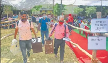  ?? HT PHOTO ?? Officials carrying ballot boxes for panchayat polls.