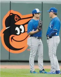  ?? CHARLIE RIEDEL/ THE ASSOCIATED PRESS ?? Kansas City Royals manager Ned Yost, right, chats with pitcher Jason Vargas on Thursday in Baltimore.