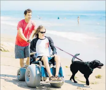  ?? Josh Gill ?? BEACH WHEELCHAIR­S can be rented at many California spots. Here, one is used in Santa Barbara.