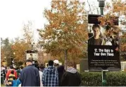  ?? Courtesy photo ?? Attendees walk during the Human Rights Walk and Festival at Town Green Park. Since it was founded in 2011, the Human Rights Walk and Festival in The Woodlands has been the largest Human Rights Day celebratio­n in the United States.