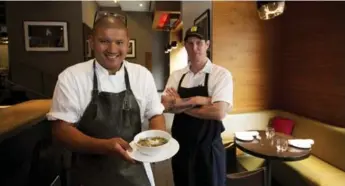  ?? TODD KOROL/TORONTO STAR ?? Chef David Lee and sous chef Trevor Stockwell show their comforting Yucatan Hot and Sour Soup at Nota Bene.