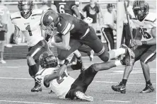  ?? Michael Wyke / Contributo­r ?? Ridge Point's John Paul Richardson jumps over Dekaney's Demetris Brooks and lands in the end zone for a touchdown.