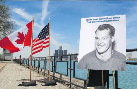  ?? DAVE CHIDLEY/THE CANADIAN PRESS FILES ?? A photo of hockey great Gordie Howe was unveiled during the announceme­nt in May 2015 that a new bridge will be named the Gordie Howe Internatio­nal Bridge in Windsor, Ont. Bridging North America is expected to start major constructi­on in the fall.