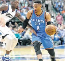  ?? [AP PHOTO] ?? Oklahoma City’s Russell Westbrook drives against Dallas’ Dorian Finney-Smith during Monday night’s NBA game at American Airlines Center. Westbrook would later hit the gamewinnin­g shot with 7.1 seconds left the fourth quarter, giving the Thunder a 92-91...