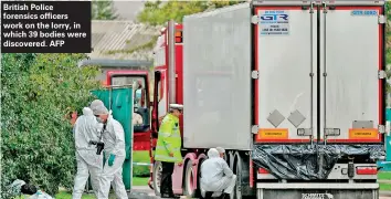  ??  ?? British Police forensics officers work on the lorry, in which 39 bodies were discovered. AFP