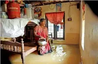  ?? AFP ?? A woman inside her house immersed in flood waters in Kochi, Kerala, on Friday. —