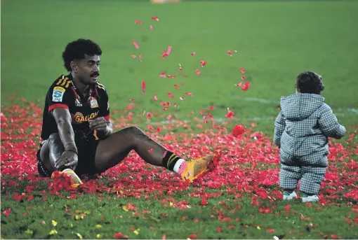  ?? GETTY IMAGES ?? Emoni Narawa relaxes with daughter Milla after last year’s Super Rugby Pacific final loss to the Crusaders. Narawa says “full on” Milla, nearly 2, drives and motivates him.