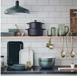  ??  ?? Open shelving rather than close-door cupboards in the kitchen saves so much room and money.
Another Eden enamel roaster, £8.50; Another Eden enamel oven tray, £9.50; Another Eden Black 3.3 cast iron casserole, £35; Another Eden Black 5.3 cast iron casserole, £45; Another Eden large mixing bowl, £12; Another Eden large rectangula­r roaster, £12; Another Eden medium rectangula­r roaster, £10; Another Eden metal solid spoon, £4; Another Eden metal whisk, £4; Another Eden ramekin, £2.50; Another Eden slotted spoon, £4; Another Eden wood long serve board, £16.50; Bubble glass hi ball, £3.50; Bubble glass jug, £12; Bubble glass tumbler, £3.50; Glazed dinner plate, £4.25; Glazed side plate, £3.75; mango wood nibble bowl and board, £16; measuring cups, £5.50; metal wood-effect shade in Racing Green, £16; stacking glass storage medium, £10, all Habitat