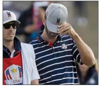  ?? AP/ALASTAIR GRANT ?? American Dustin Johnson reacts during his and Rickie Fowler’s foursome loss to Europe’s Henrik Stenson and Justin Rose on Friday at the Ryder Cup.