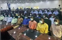  ?? THE ASSOCIATED PRESS ?? Students and teachers who were abducted by gunmen from the Government Science College Kagara two weeks ago are seen after their release meeting with the state Governor Abubakar Sani Bello, in Minna, the capital of Niger state, in Nigeria Saturday, Feb. 27, 2021.