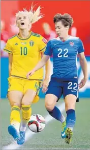  ?? Kevin C. Cox
Getty I mages ?? MEGHAN KLINGENBER­G of the U. S., right, applies pressure to Sofia Jakobsson of Sweden.