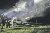  ?? PHOTOGRAPH­S: ALESSIO MAMO AND OLEG SOLOKHA/THE GUARDIAN ?? Miezientse­v uses a Maxim heavy machine gun made in 1944 to shoot down drones, left. Right, members of the 241st territoria­l defence brigade on a night-time training exercise in April