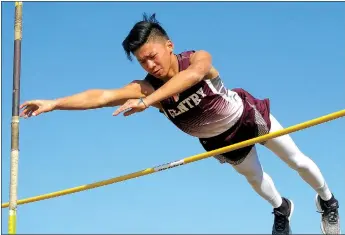  ?? Westside Eagle Observer/RANDY MOLL ?? Ethan Xiong of Gentry clears the bar during pole vault competitio­n at the Gravette High School track meet on March 15. See story on B1.