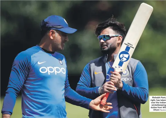  ?? Reuters ?? Rishabh Pant, right, has taken over the Indian wicketkeep­ing duties from MS Dhoni