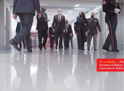  ?? Photo: Nampa/AFP ?? On a mission… President Joe Biden (centre), accompanie­d by Vice President Kamala Harris, Secretary of Defence Lloyd Austin and Joint Chiefs Chairman Gen. Mark Milley, tours the African Americans in Defence of our Nations Corridor at the Pentagon.