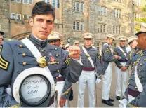 ?? Spenser Rapone / Associated Press ?? Spenser Rapone, by then already a combat veteran who had served with the First Ranger Battalion in Afghanista­n, displays a sign inside his hat after his 2016 West Point graduation.