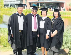  ?? The four students who flew over from Singapore to receive their degrees at Edge Hill University’s graduation ceremony ??