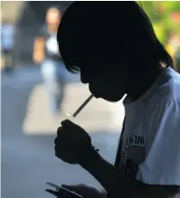  ?? JES AZNAR/Getty Images ?? The Philippine president signed a law requiring companies to put warnings on cigarette packs in a country where tens of thou
sands die every year from tobacco-linked diseases.