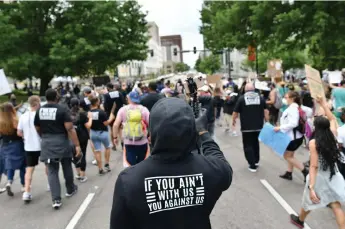  ??  ?? Broncos’ linebacker Von Miller takes part in a march to protest the death of George Floyd. Nearly 50 players and 20 coaches took part Saturday in downtown Denver.