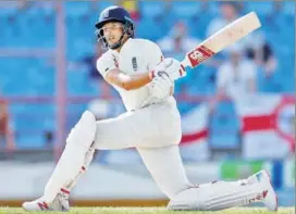  ?? REUTERS ?? Captain Joe Root’s unbeaten 111 put England on top in the third Test against Windies on Monday.