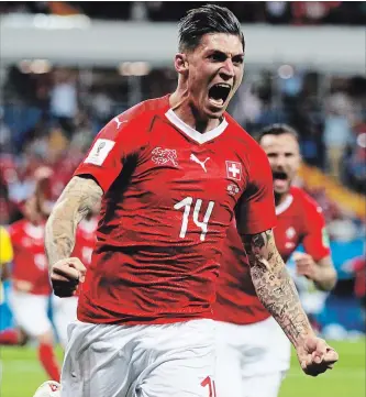  ?? KEVIN C. COX
GETTY IMAGES ?? Steven Zuber of Switzerlan­d celebrates after scoring his team’s goal during the 2018 FIFA World Cup Russia group E match against Brazil at Rostov Arena on Sunday in Rostov-on-Don, Russia.