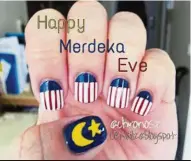  ??  ?? This has to be the most perfect crescent and star design on a nail, with its meticulous lines and contouring. The thumbnail design takes centrestag­e while the rest of the nails are uniform and chic in blue, red and white. — CRNailz blogspot