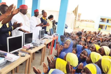  ?? PHOTO Sani Maikatanga ?? Kano State Commission­er of Agricultur­e, Dr. Yusuf Gawuna (second left) addresses students of Rochas Foundation College, after the state government’s donation of set of desktop computers and sitting tools to the school in Kano